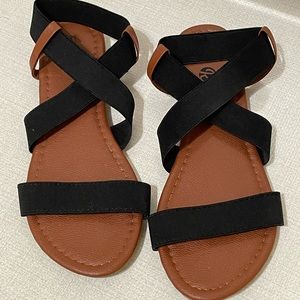 Tan sandals with black straps